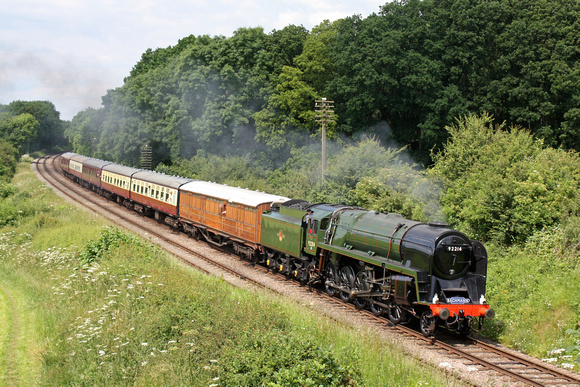 British Railways Standard Class 9F 2-10-0 No 92214 now re-painted in Brunswick green and lined out is seen at Kinchley Lane on 21.6.14 with 1415 Loughborough - Leicester North service at the GCR Model