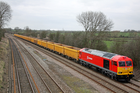 Latest supertug 60063 in shiny DB Schenker livery at Normanton on Soar heading towards Loughborough on 8.3.12 with 6M23 1257 Doncaster Belmont -  Mountsorrel empty IOA ballast boxes
