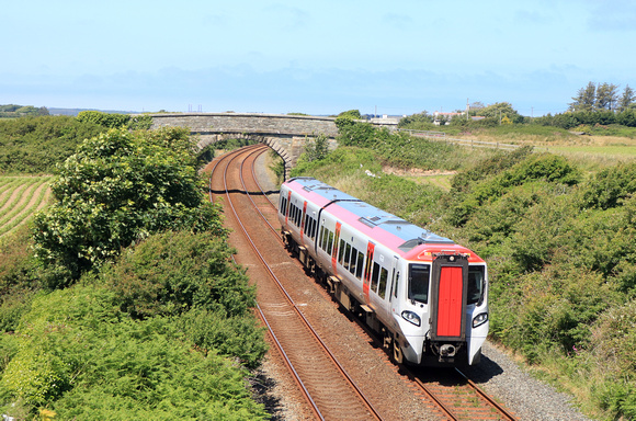 TfW Class 197 No 197007 is seen at Valley, Anglesey, North Wales on 24.6.24 with 1V96 1233 Holyhead to Ludlow service. This service was cancelled between Ludlow & Cardiff Central due to a  train tprob