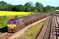 66181 passes a beautiful yellow rape seed field at Hathern, MML on 16.6.09 with 6E38 1354 Colnbrook - Lindsey Oil Refinery empty bogie oil tanks