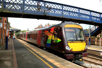 CrossCountry Class 170 No 170618 bearing Pride livery on front and back ends waits at Melton Mowbray station on 2.8.24 with 1N47 0826 Stansted Airport to Birmingham New Street service