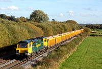 70016 at Barrow Upon Trent heading towards Stenson Junction on 30.10.13 with 6U77 1344 Mountsorrel Sdgs - Crewe Basford Hall S.S.N. loaded yellow IOA wagons in lovely autumn sun and colours