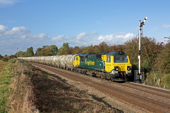 70004'The Coal Industry Society'  passes the signal at Ashwell near Oakham (Rutland) on 17.10.12 with  6L87  1237 Earles Sdgs - West Thurrock loaded PCA cement tanks