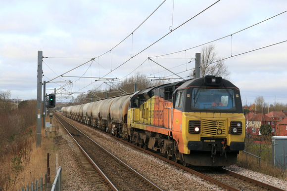 Colas Rail Freight Class 70 No 70802 approaches Tyne and Wear Metro Fellgate station on 3.3.25 with 6E90 0635 Oxwellmains Lafarge Colas to Seaham Harbour Colas Rail loaded cement tanks