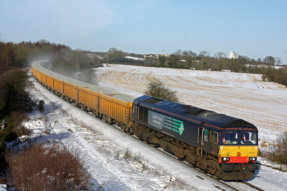 DRS 66423 at a snowy Bagworth Incline on 26.1.13 with 6L76 1130 SO Stud Farm Quarry - Whitemoor via Leicester loaded IOA ballast wagons. GBRf operates this working on weekdays