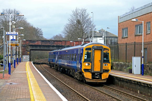 ScotRail Class 158 No 158740 waits at Maryhill Station on 2.2.23 with 2W57 1403 Glasgow Queen Street to Anniesland service
