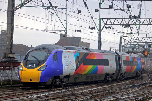 In the pouring rain Avanti West Coast Pride Pendolino No 390119 enters Glasgow Central Station on 11.2.23 with 1S42 0730 London Euston to Glasgow Central service