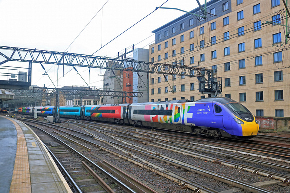 In the pouring rain Avanti West Coast Pride Pendolino No 390119 heads into Glasgow Central Station on 11.2.23 with 1S42 0730 London Euston to Glasgow Central service