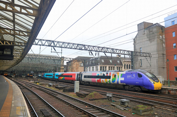 Avanti West Coast Pride Pendolino No 390119 waits at Glasgow Central Station on 11.2.23 with 1M13 1240 Glasgow Central to London Euston service
