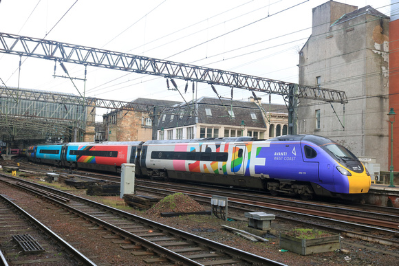 Avanti West Coast Pride Pendolino No 390119 waits at Platform 2 at Glasgow Central Station on 11.2.23 with 1M13 1240 Glasgow Central to London Euston service