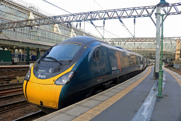 Avanti West Coast  390129 'City of Stoke-on-Trent' now carries the name ‘Brett’ on both of its cab ends In memory of Brett Hobson. On 11.2.23 the Pendolino  waits at Glasgow Central with 1M12 1136 to