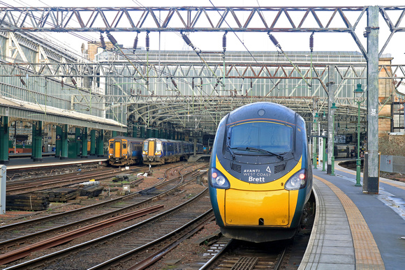 Glasgow Central Staion on 11.2.23. From l to r Scotrail 156506, 156504 & 156511 2J32 1117 to East Kilbride, ScotRail 380104 2N32 1105 to Neilston, Avanti West Coast 390129 1M12 1136 to London Euston s