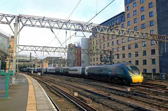 Avanti West Coast  390129 'City of Stoke-on-Trent' now carries the name ‘Brett’ on both of its cab ends In memory of Brett Hobson. On 11.2.23 the Pendolino departs Glasgow Central with 1M12 1136 to Lo