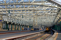 Glasgow Central Station high numbered platforms on 11.2.23. Lto r ScotRail 380105 2K73 1134 to Ayr, ScotRail 320319  2D20 1105 from Paisley Canal & ScotRail 156435 & 156514 depart with 1A24 1127 to Ki