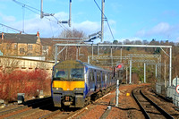 In need of a wash ScotRail Class 320 No 320304 passes Knightswood South Junction, Anniesland on 17.2.23 with 2E72 1108 Balloch to Airdrie service. The line on the right is to Maryhill Junction and Mar