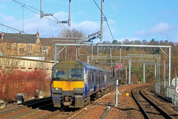 In need of a wash ScotRail Class 320 No 320304 passes Knightswood South Junction, Anniesland on 17.2.23 with 2E72 1108 Balloch to Airdrie service. The line on the right is to Maryhill Junction and Mar