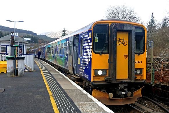 ScotRail Class 153 No 153373 with bicycle carrying vynyls and Scotrail Class 156 No 156458 wait at Crianlarich Station,  West Highland line on 17.3.23 with 1Y25 1036 Glasgow Queen Street to Oban servi