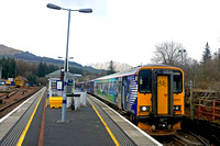 ScotRail Class 153 No 153373 with bicycle carrying vynyls and Scotrail Class 156 No 156458 wait at Platform 2, Crianlarich Station, West Highland line on 17.3.23 with 1Y25 1036 Glasgow Queen Street to