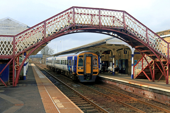 Northern Class 158 No 158851 waits at Hexham Station on 25.3.23 with 2A36 1437 Carlisle to Morpeth service