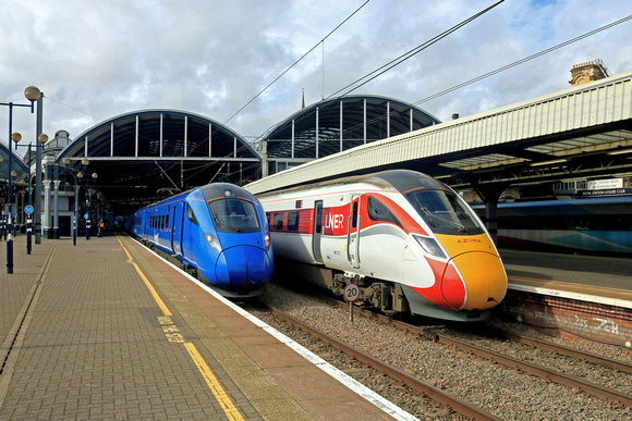 Newcastle Central Station on 26.2.23. On left LUMO Class 803 No 803002 with 1S93 1023 London Kings Cross to Edinburgh, right is LNER Azuma Class 801 No 801211 with 1S11 1003 London Kings Cross to Edin