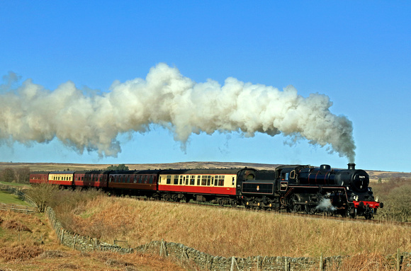 On the first day of the NYMR 2023 timetable BR Standard 4MT No. 76079 is seen at Moorgates in full steam on 27.3.23 with 1410 Whitby to Pickering service