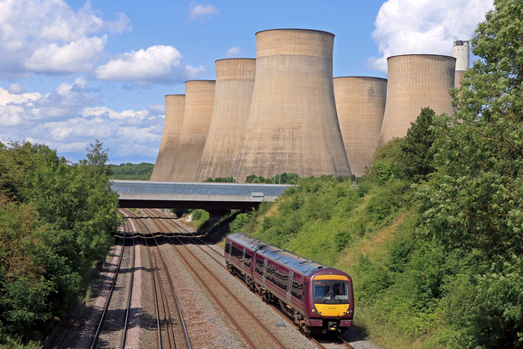 EMR Class 170 No 170517 passes Ratcliffe On Soar, with Ratcliffe Power Station behind on 21.6.23 with 2L66 1241 Grimsby Town to Leicester service