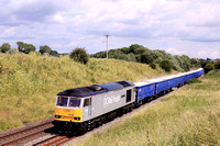 DC Rail Freight Class 60 No 60055 'Thomas Barnardo' passes Copley's Brook, Melton Mowbray on 24.6.23 with 6M89 0901 Middleton Towers to Ravenhead Sdgs loaded blue sand wagons