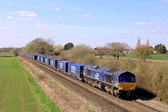 DRS Class 66 No 66433 passes Barrow upon Trent heading towards Castle Donington on 3.4.23 with 4E49 1038 Daventry Drs (Tesco) to Doncaster Iport Tesco containers