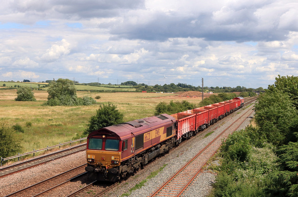 DB Cargo Class 66's 66221 tnt 66078 pass Melton Mowbray on 26.6.23 with 6M64 0925 Norwich Goods Yard to Toton North Yard empty red box wagons