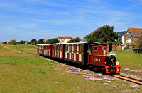 The Hayling Light Railway is a 2ft narrow gauge line that runs along the south coast of Hayling Island between Eastoke Corner and Beachlands. On 28.5.23 No 3 'Jack' approaches Mengham Road with 1105 o