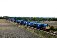 DRS Class 66 No 66431 Kingmoor TMD passes Plawsworth near Durham, ECML on a dull 6.10.24 in charge of 4E65 0952 Coatbridge (Drs) to South Bank Tees Dock (Drs) well loaded Tesco Intermodal
