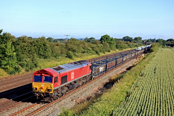 DB Cargo Class 66 No 66206 slowly passes Cossington, MML on 21.6.23 with 6X11 0700 Toton North Yard to Dollands Moor  Sdgs Toyota Car train