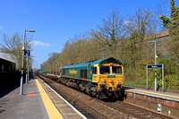 Freightliner Class 66 No 66505 races through Overton Station, Hampshire on 18.4.23 with 4M58 0927 Southampton M.C.T. to Garston F.L.T. via Andover  Intermodal