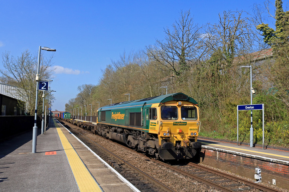 Freightliner Class 66 No 66505 races through Overton Station, Hampshire on 18.4.23 with 4M58 0927 Southampton M.C.T. to Garston F.L.T. via Andover  Intermodal