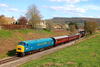 Preserved Peak Class 45 No 45149  Preserved Class 47 No 47105 departs Winchcombe station seen at Greet on 7.4.23 with 1535 Broadway to Cheltenham GWSR service.