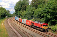 DB Cargo Class 66 No 66017 in red livery passes Barrow upon Soar, MML on 29.6.23 with 4L38 1057 East Mids Gateway Tml Dbc to Felixstowe Central Dbc Intermodal
