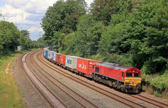 DB Cargo Class 66 No 66017 in red livery passes Barrow upon Soar, MML on 29.6.23 with 4L38 1057 East Mids Gateway Tml Dbc to Felixstowe Central Dbc Intermodal