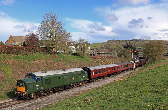 Preserved Class 37 No D6948 (37248) powers away from Winchcombe station seen at Greet on 12.4.23 with 1535 Broadway to Cheltenham GWSR service.