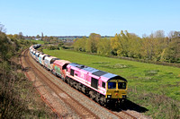Freightliner Class 66 No 66587 'AS ONE, WE CAN' in One Pink Livery at Hungerford Common on 20.4.23 with late running 6M20 1038 Whatley Quarry F Liner Hh to Churchyard Sdgs (Flhh) loaded hoppers