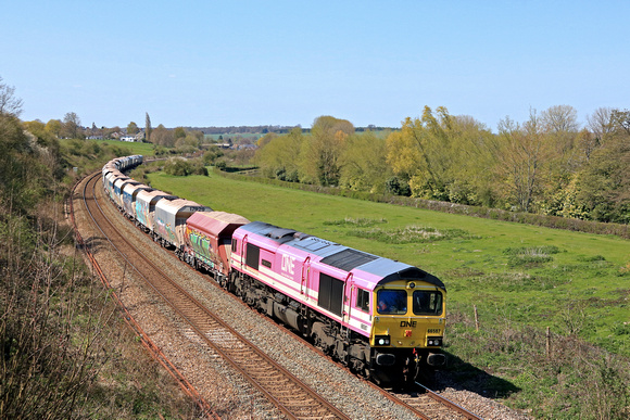 Freightliner Class 66 No 66587 'AS ONE, WE CAN' in One Pink Livery at Hungerford Common on 20.4.23 with late running 6M20 1038 Whatley Quarry F Liner Hh to Churchyard Sdgs (Flhh) loaded hoppers