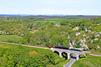 D6515 'Lt Jenny Lewis RN' (33012)  drags SR 2-6-0 - U Class No 31806 from Norden Sdgs to Swanage on the Swanage Railway seen on Corfe Castle Viaduct on 22.5.23. 31806 had been at Glos and Warks Railwa