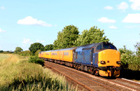 Class 37 No's 37612 in blue livery with 37254 in Colas livery at rear at Langham Crossing on 19.6.23 tnt 1Q90 1515 Derby R.T.C.(Network Rail) to Ferme Park Recp. monthly test train
