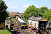 Swanage Railway Class 117 DMU (consisting of vehicles W51356, W59486 and W51388) passes Swanage engine shed on 24.5.23 with 2C19 1119 Wareham to Swanage link service