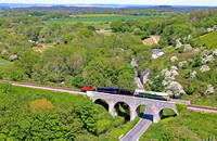 D6515 'Lt Jenny Lewis RN' (33012)  drags SR 2-6-0 - U Class No 31806 from Norden Sdgs to Swanage on the Swanage Railway seen at iCorfe Castle Viaduct on 22.5.23. 31806 had been at Glos and Warks Railw