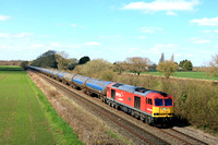 DB Cargo 60007 'The Spirit of Tom Kendel' in DB Schenker livery  passes Barrow Upon Trent on 3.4.23 with 6E54 1104 Kingsbury Oil Sdgs to Humber Oil Refinery empty tanks