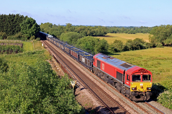 DB Cargo Class 66 No 66206 slowly passes Syston heading towards Melton Mowbray on 21.6.23 with 6X11 0700 Toton North Yard to Dollands Moor  Sdgs Toyota Car train