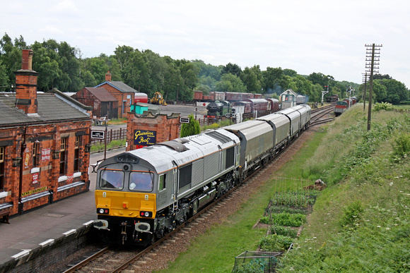 D7612 drags GBRf 66749 in grey livery with 4 biomass hoppers passes through Quorn & Woodhouse station, GCR on 3.7.13 to begin 75mph brake and noise testing between Swithland and Little Woodthorpe
