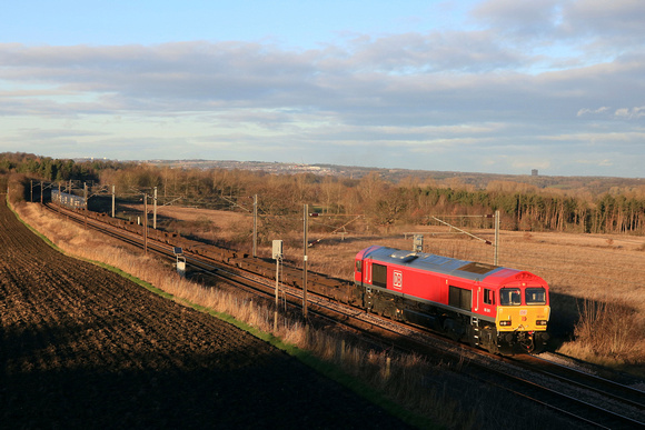 An extremely clean DB Cargo Class 66 No 66041 passes Plawsworth near Durham on 3.1.25 with 4E96 0900 Mossend Euroterminal to Tees Dock Bsc Export Berth lightly loaded Intermodal due to Christmas & New