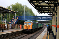 Class 56 No 56081 enters a wet Melton Mowbray Station dragging new EMR Class 810 No 810001 on 14.7.23 with 5Q47 0828 Merchant Park Sidings to Old Dalby for Testing work at Melton RIDC, Asfordby. 47749