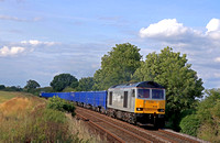 DC Rail Freight Class 60 No 60055  approaches Langham Junction on 6.7.23 with 6Z29 1449 Peak Forest Cemex Sdgs to Brandon Down Goods Loop loaded blue box wagons